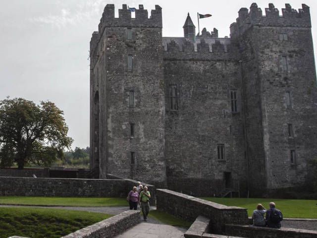 People walking beside Bunratty Castle | Luxury Tour Operator Ireland