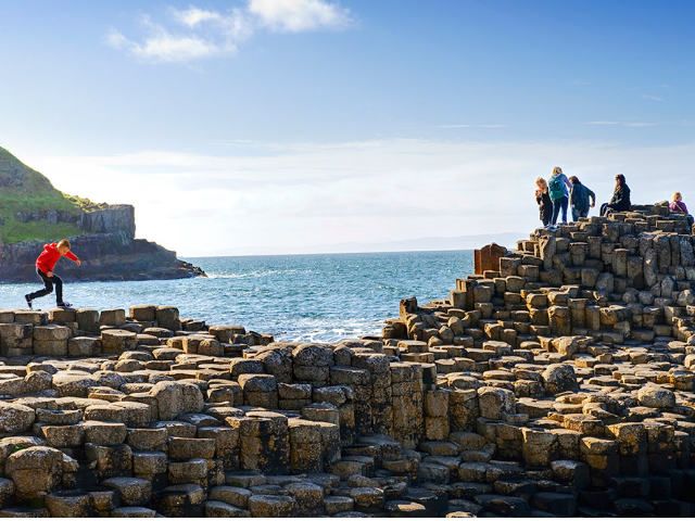 People standing on the Giant's Causeway | Family Tours Ireland