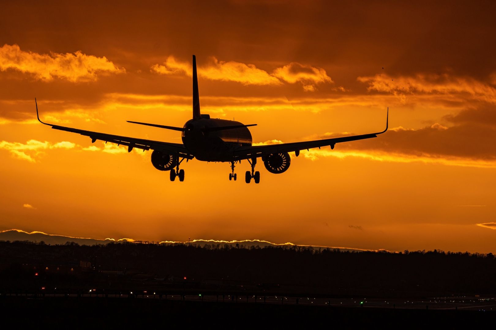 airplane flying against sunset | Luxury Tours Ireland